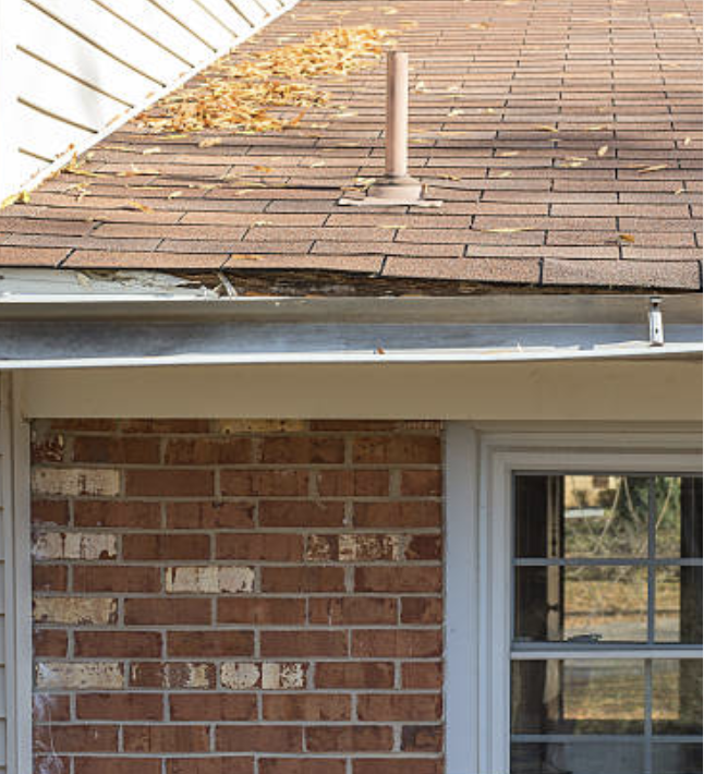 Damaged walls from overflowing water by blocked gutters